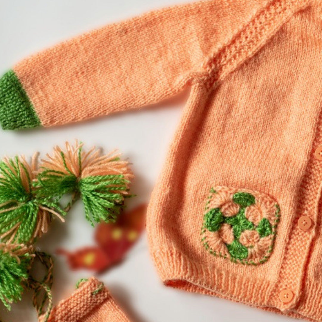 Peach Handknitted Woollen Set for infants.